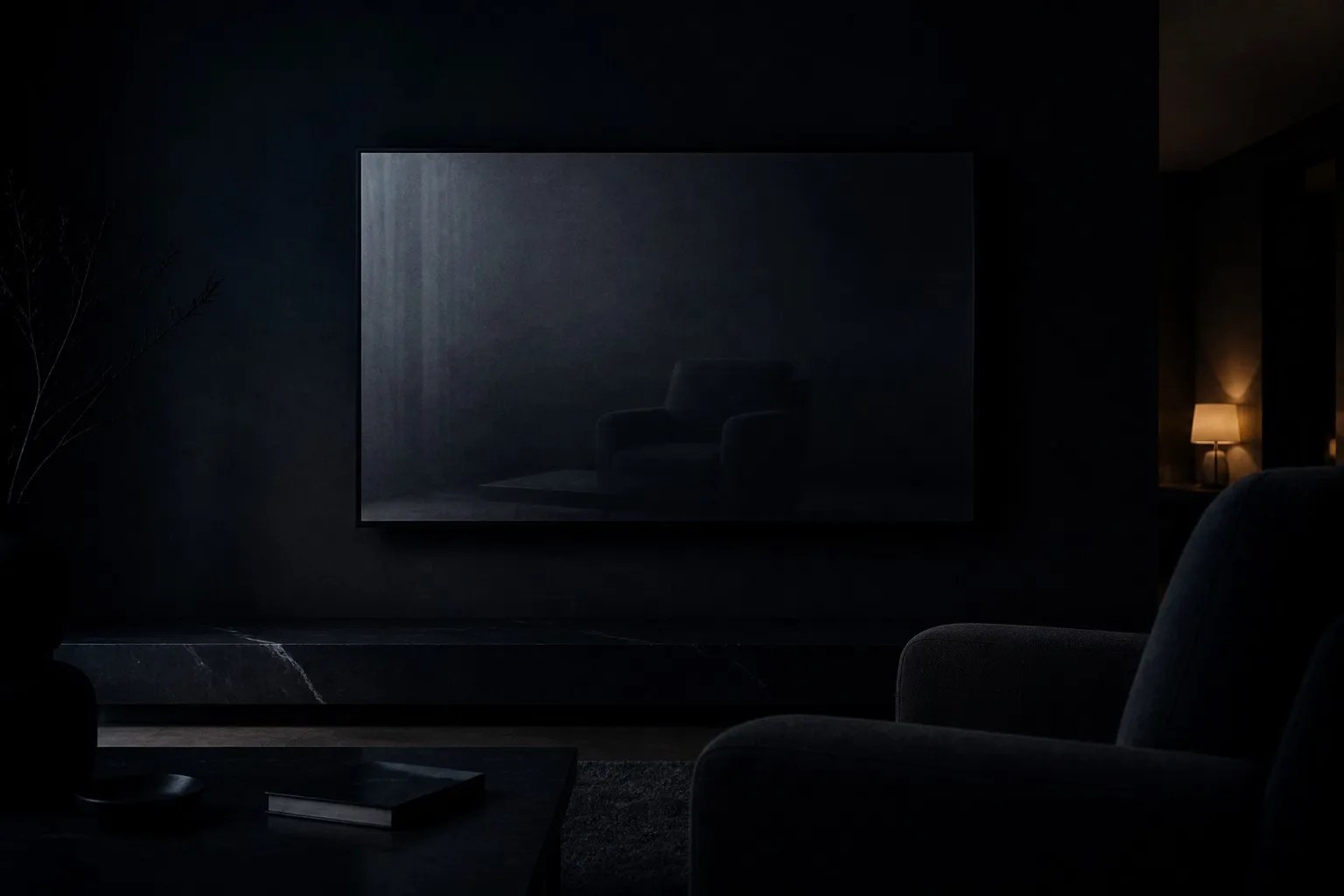 A dark living room at night, the faint grey glow of a television screen reflecting an empty armchair